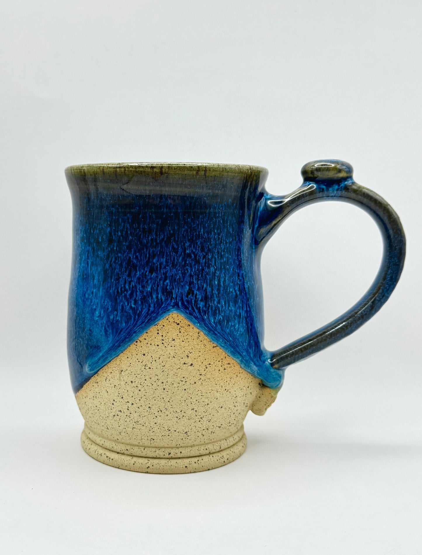 Flowing Blue over Speckle Clay - 18 oz.